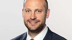 Headshot of Prof. Dr. Sebastian J. Goerg , a middle age man smiling on a simple white  background.