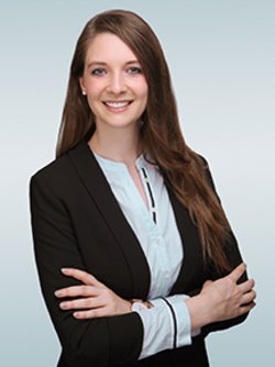 lisa grundl wearing black blazer and smiling 
